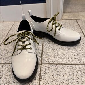 White patent leather loafers